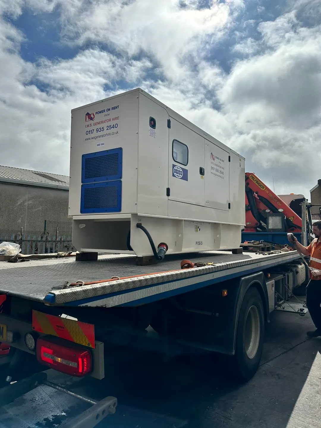 A truck with a generator on the back of it.